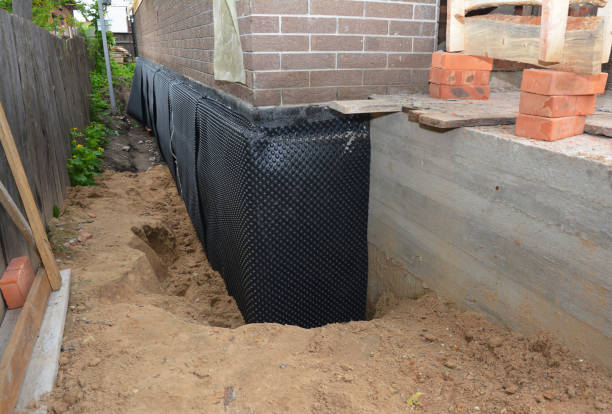 Happy homeowners after waterproofing job in Spring Arbor